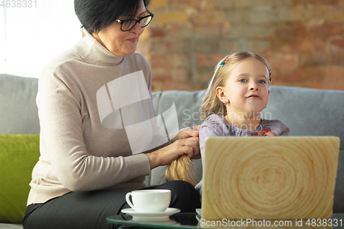 Image of Happy loving family. Grandmother and grandchild spending time together