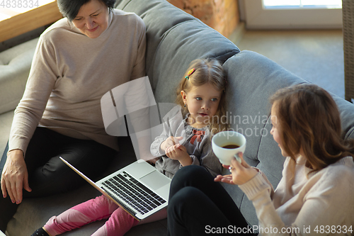 Image of Happy loving family. Grandmother, mother and daughter spending time together
