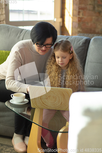Image of Happy loving family. Grandmother and grandchild spending time together