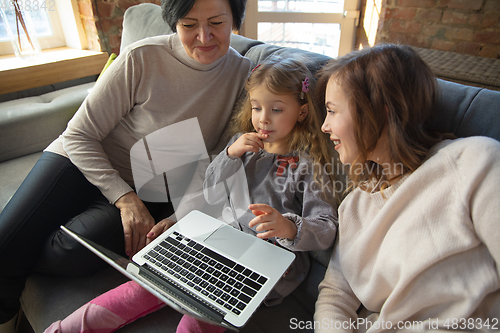 Image of Happy loving family. Grandmother, mother and daughter spending time together