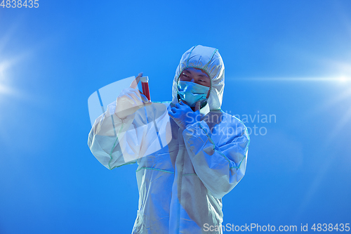 Image of Medic in white hazmat protective suit, coronavirus illustration concept