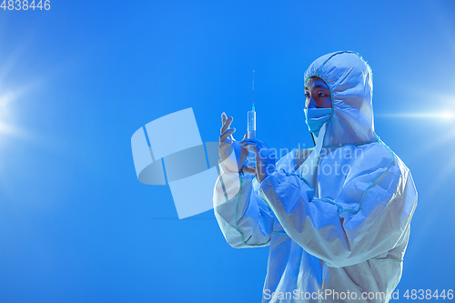 Image of Medic in white hazmat protective suit, coronavirus illustration concept