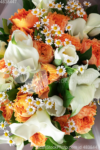 Image of Close up of fashion modern bouquet of different flowers on wooden background