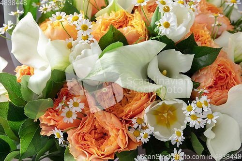 Image of Close up of fashion modern bouquet of different flowers on wooden background