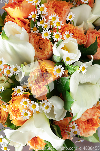 Image of Close up of fashion modern bouquet of different flowers on wooden background