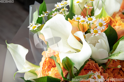 Image of Close up of fashion modern bouquet of different flowers on wooden background