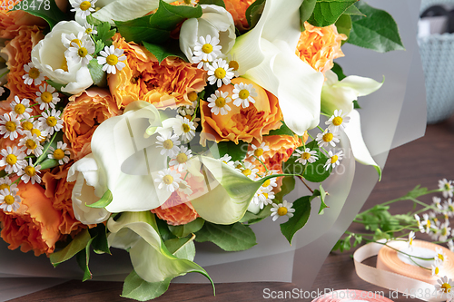 Image of Close up of fashion modern bouquet of different flowers on wooden background