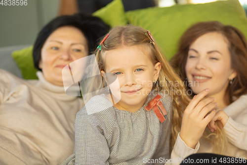 Image of Happy loving family. Grandmother, mother and daughter spending time together