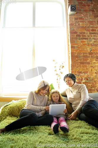 Image of Happy loving family. Grandmother, mother and daughter spending time together