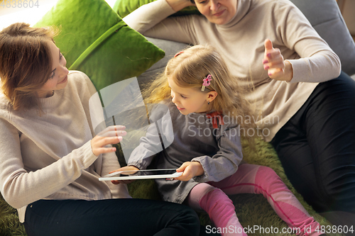 Image of Happy loving family. Grandmother, mother and daughter spending time together