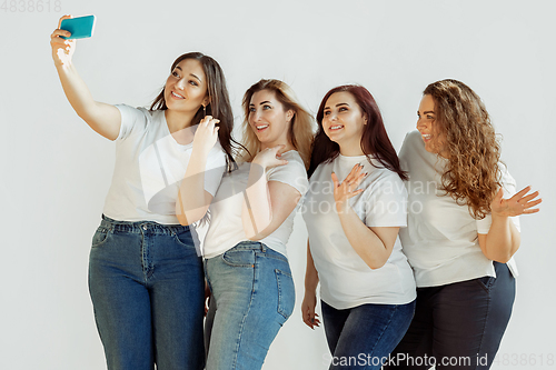 Image of Young women in casual clothes having fun together. Bodypositive concept.