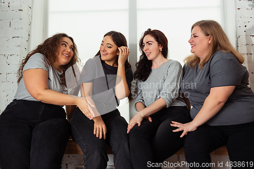 Image of Young women in casual clothes having fun together. Bodypositive concept.