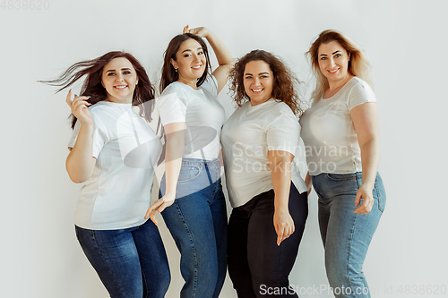 Image of Young women in casual clothes having fun together. Bodypositive concept.