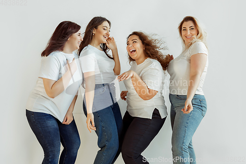 Image of Young women in casual clothes having fun together. Bodypositive concept.