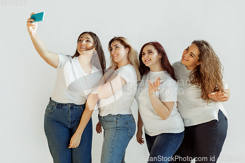 Image of Young women in casual clothes having fun together. Bodypositive concept.