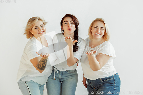 Image of Young women in casual clothes having fun together. Bodypositive concept.