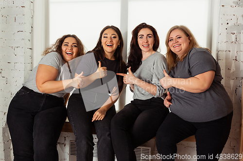 Image of Young women in casual clothes having fun together. Bodypositive concept.