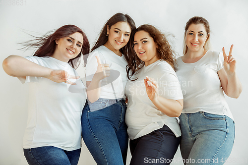 Image of Young women in casual clothes having fun together. Bodypositive concept.