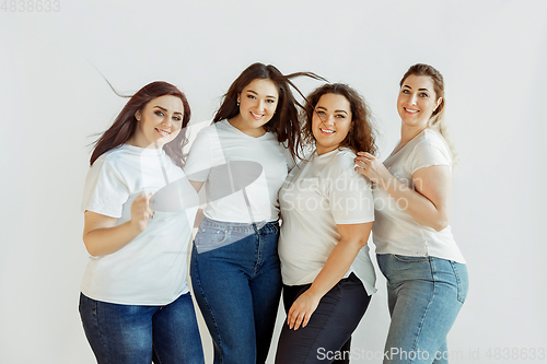 Image of Young women in casual clothes having fun together. Bodypositive concept.