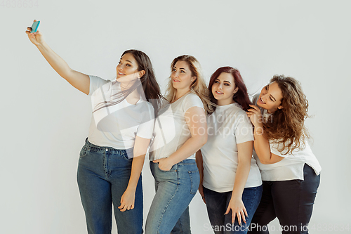 Image of Young women in casual clothes having fun together. Bodypositive concept.