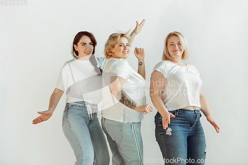 Image of Young women in casual clothes having fun together. Bodypositive concept.