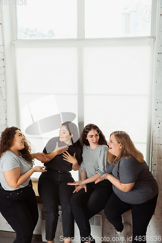 Image of Young women in casual clothes having fun together. Bodypositive concept.