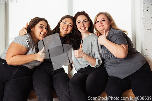 Image of Young women in casual clothes having fun together. Bodypositive concept.