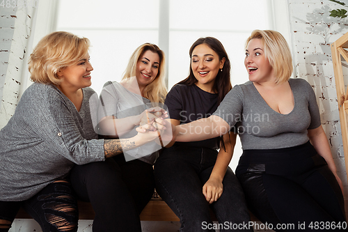 Image of Young women in casual clothes having fun together. Bodypositive concept.