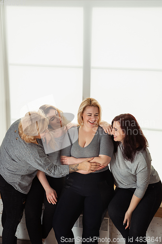 Image of Young women in casual clothes having fun together. Bodypositive concept.