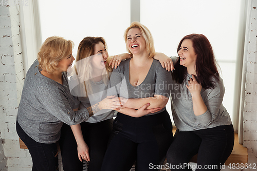 Image of Young women in casual clothes having fun together. Bodypositive concept.