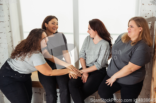 Image of Young women in casual clothes having fun together. Bodypositive concept.