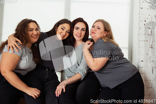 Image of Young women in casual clothes having fun together. Bodypositive concept.