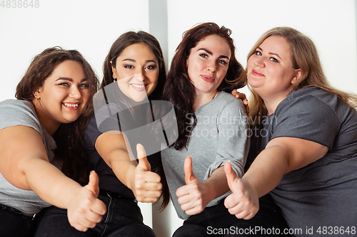 Image of Young women in casual clothes having fun together. Bodypositive concept.