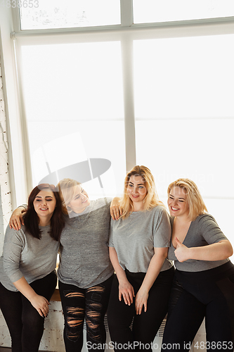 Image of Young women in casual clothes having fun together. Bodypositive concept.