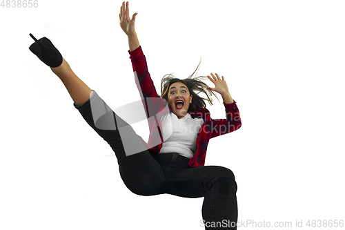 Image of A second before falling - young girl falling down with bright emotions and expression