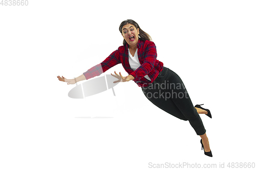 Image of A second before falling - young girl falling down with bright emotions and expression