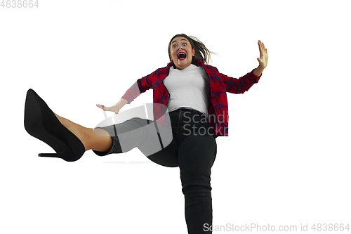 Image of A second before falling - young girl falling down with bright emotions and expression