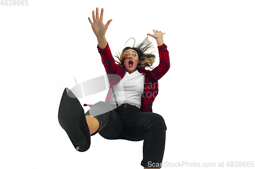 Image of A second before falling - young girl falling down with bright emotions and expression