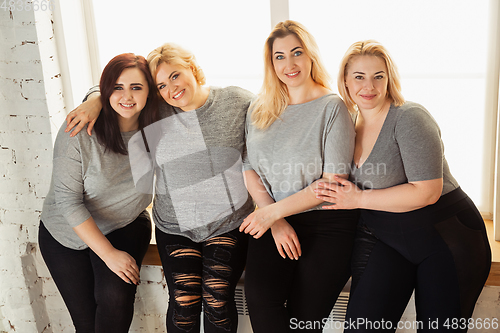 Image of Young women in casual clothes having fun together. Bodypositive concept.