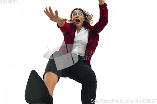 Image of A second before falling - young girl falling down with bright emotions and expression