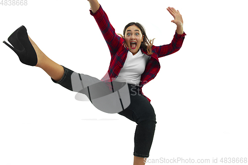 Image of A second before falling - young girl falling down with bright emotions and expression