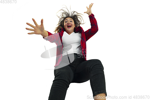 Image of A second before falling - young girl falling down with bright emotions and expression