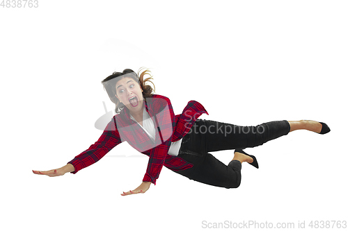 Image of A second before falling - young girl falling down with bright emotions and expression