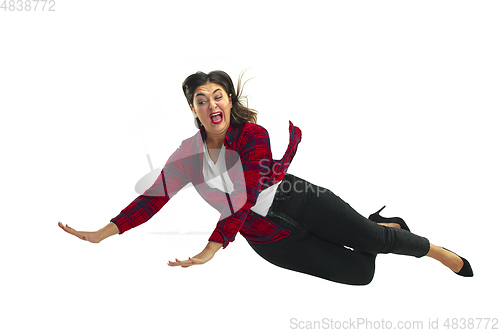 Image of A second before falling - young girl falling down with bright emotions and expression