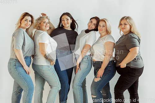 Image of Young women in casual clothes having fun together. Bodypositive concept.