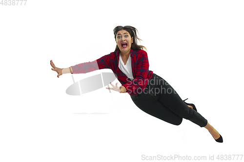 Image of A second before falling - young girl falling down with bright emotions and expression