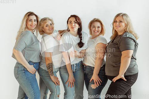 Image of Young women in casual clothes having fun together. Bodypositive concept.