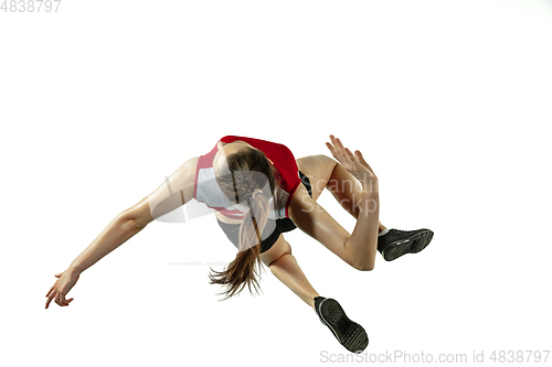 Image of Young female volleyball player isolated on white studio background in flight and motion