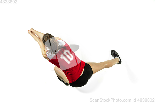 Image of Young female volleyball player isolated on white studio background in flight and motion