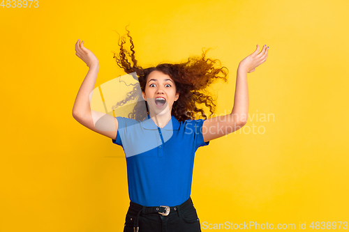 Image of Caucasian teen\'s girl portrait on yellow background
